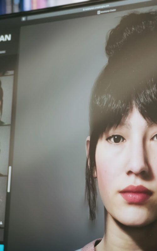 woman in black shirt near white wooden shelf